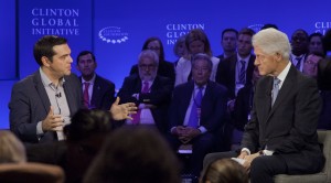 Greek Prime Minister Alexis Tsipras, left, participates in an interview with former President Bill Clinton, Sunday, Sept. 27, 2015 at the Clinton Global Initiative in New York. (AP Photo/Mark Lennihan)