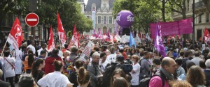Technicians and nurses demonstrate in Paris, France, Thursday May 28, 2015, outside the headquarters of Paris regional hospital authority. Thousands of doctors, nurses and other hospital personnel are demonstrating in central Paris to protest a planned working-hours reform they say will result in more burnout and worse patient care. Banners with slogans like Taking away our rights never made the economy grow lined the roadway near the citys Renaissance-style city hall, visible in background. (AP Photo/Remy de la Mauviniere)