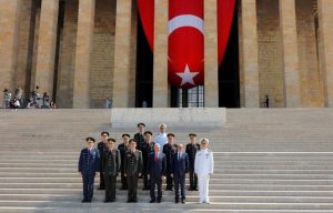 Turkey's Prime Minister Binali Yildirim (3rd R), Chief of Staff General Hulusi Akar (3rd L), Defense Minister Fikri Isik (2nd R) and the country's top generals pose in Anitkabir, the mausoleum of modern Turkey's founder Mustafa Kemal Ataturk, after a wreath-laying ceremony ahead of a High Military Council meeting in Ankara, Turkey, July 28, 2016. REUTERS/Umit Bektas