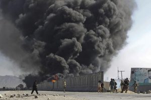 Smoke billows from a fuel tank supplying NATO troops, after it was set on fire by protesters during a demonstration in Jalalabad province February 22, 2012. Gunfire wounded at least 26 people during fresh protests in several cities across Afghanistan over the burning of copies of the Koran, Islam's holy book, at NATO's main base in Afghanistan. REUTERS/Parwiz (AFGHANISTAN - Tags: CIVIL UNREST RELIGION TPX IMAGES OF THE DAY)