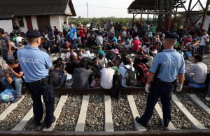 TOPSHOTS Migrants wait for a train at  a railway station, near the official border  between Serbia and Croatia, near Eastern-Croatian town of Tovarnik, on September 17, 2015. Migrants headed for Western-European countries have found a new route between countries to cross into the EU, after Hungarian authorities have physicaly closed it's borders towards Serbia. For the moment, Croatia copes well with the influx of refugees, being still able to keep evidence of the people arriving and transporting them by train to refugee transit centres closer to nation's capital, Zagreb. AFP PHOTO/STRSTR/AFP/Getty Images