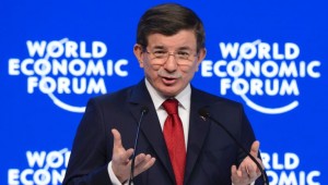 Turkish Prime Minister Ahmet Davutoglu addresses the assembly during the World Economic Forum (WEF) annual meeting in Davos, on January 21, 2016.  Rising risks to the global economy and a string of jihadist attacks around the world overshadowed opening of an annual meeting of the rich and powerful in a snow-blanketed Swiss ski resort. / AFP / FABRICE COFFRINI