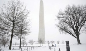 The grounds around the Washington Monument are covered in snow during a winter storm in Washington