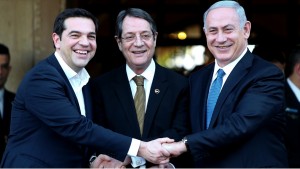 Cypriot president Nicos Anastasides, centre, Greek Prime Minister Alexis Tsipras, left, and  Israeli Prime Minister Benjamin Netanyahu shake hands after leaving their meeting from the presidential palace in capital Nicosia in the Mediterranean island of Cyprus, Thursday, Jan. 28, 2016. The leaders of Cyprus, Greece and Israel met in the Cypriot capital with the aim to strengthen cooperation and bolster stability in a region wracked by conflict. The talks are the first tripartite summit. Discussions will cover newly found offshore gas reserves and tourism, while the leaders will sign a cooperation agreement on water resources. (AP Photo/Petros Karadjias)