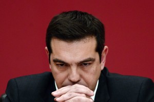 TOPSHOTS The leader of the leftist Syriza party, Alexis Tsipras, listens to a question during a televised press conference on January 23, 2015 at the Zappion Hall in Athens. Greeks vote on January 25 in a general election for the second time in three years, with radical leftists Syriza leading the polls with a promise to renegotiate the international bailout that has imposed five years of austerity on the country. AFP PHOTO/LOUISA GOULIAMAKI