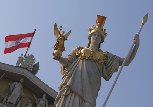 The Austrian national flag is seen at the Austrian Parliament next to the statue of Greek goddess Pallas Athena in Vienna on September 5, 2012. AFP PHOTO / ALEXANDER KLEIN (Photo credit should read ALEXANDER KLEIN/AFP/Getty Images)