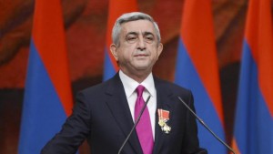 FILE - In this file photo taken on Tuesday, April 9, 2013, Armenian President Serge Sarkisian is sworn in during his inauguration ceremony in Yerevan, Armenia, Tuesday, April 9, 2013. Armenia was holding a referendum Sunday on proposed constitutional changes that would give more powers to the prime minister and parliament at the expense of the president, who would become largely a figurehead, but the opposition has seen the reform as an attempt by President Serzh Sargsyan to extend his rule. (AP Photo/Davit Hakobyan, PanARMENIAN, File)