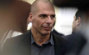 New Greek Finance Minister Yanis Varoufakis is seen after a swearing in ceremony at the Presidential Palace in Athens, Tuesday, Jan. 27, 2015. Greece's new left-wing Prime Minister Alexis Tsipras picked an outspoken bailout critic, Yanis Varoufakis, as his new finance minister Tuesday, signaling his revolve to take a tough line with eurozone lenders in an effort to write off a massive chunk rescue debt. (AP Photo/Thanassis Stavrakis)