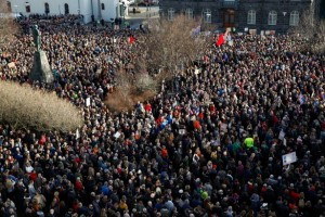 People gather to demonstrate against Iceland's prime minister, in Reykjavik on Monday April 4, 2016. Iceland's prime minister insisted Monday he would not resign after documents leaked in a media investigation allegedly link him to an offshore company that could represent a serious conflict of interest, according to information leaked from a Panamanian law firm at the center of an international tax evasion scheme. (AP Photo/Brynjar Gunnarsson)
