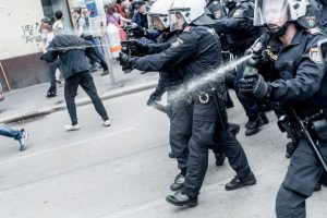 epa05357270 Austrian riot police clash with protesters during a demonstration against the 'Defend Europe' rally of the Identity Movement Austria, in Vienna, Austria, 11 June 2016. The Identity Movement is a political movement of people which believes that foreign cultures should be kept away from their own, in order to preserve an ancestral identity. EPA/CHRISTOPHER GLANZL