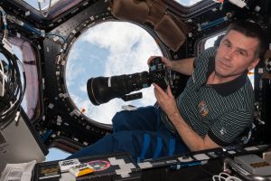 ISS-47_Yuri_Malenchenko_with_camera_in_the_Cupola_module