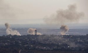 epa05534684 An image taken from the Israeli side of the border with Syria on 11 September 2016, shows smoke rising from the village of Jubata, controlled by Islamic rebels, north of Quneitra, Syria, during the third day of fighting between the Syrian army loyal to the Syrian President Bashar Al Assad and Islamic rebels continue to clash over the border territory.  EPA/ATEF SAFADI