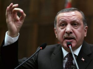 Turkey's Prime Minister Recep Tayyip Erdogan addresses the lawmakers of his Islamic-rooted Justice and Development Party at the parliament in Ankara, Turkey, Tuesday, Feb. 16, 2010.(AP Photo)